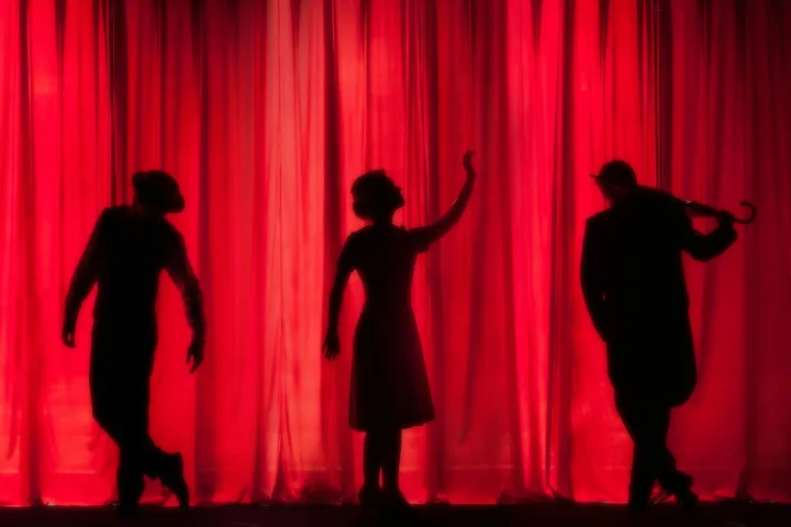 San Francisco, CA 10 Silhouette of three performing stage actors - Photo by Kyle Head on Unsplash